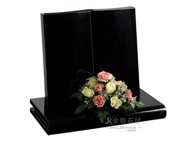 Simple book-shaped black granite tombstone